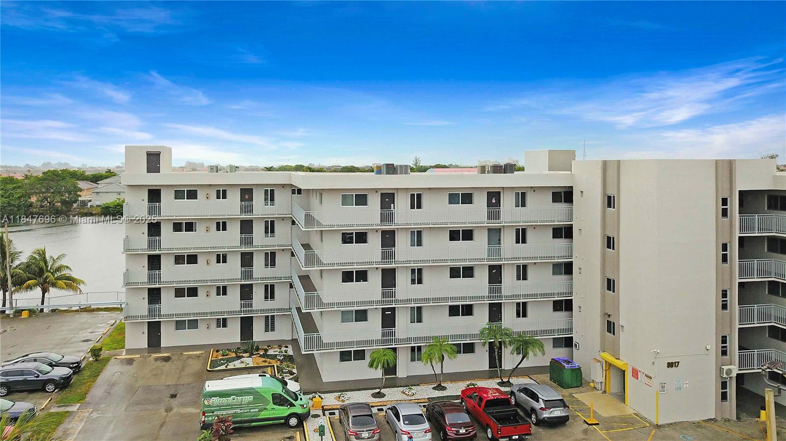 9917 West Okeechobee Road, Unit 3303 Hialeah Gardens, FL 33016 - Photo 25 of 26 a view of a building with a street view