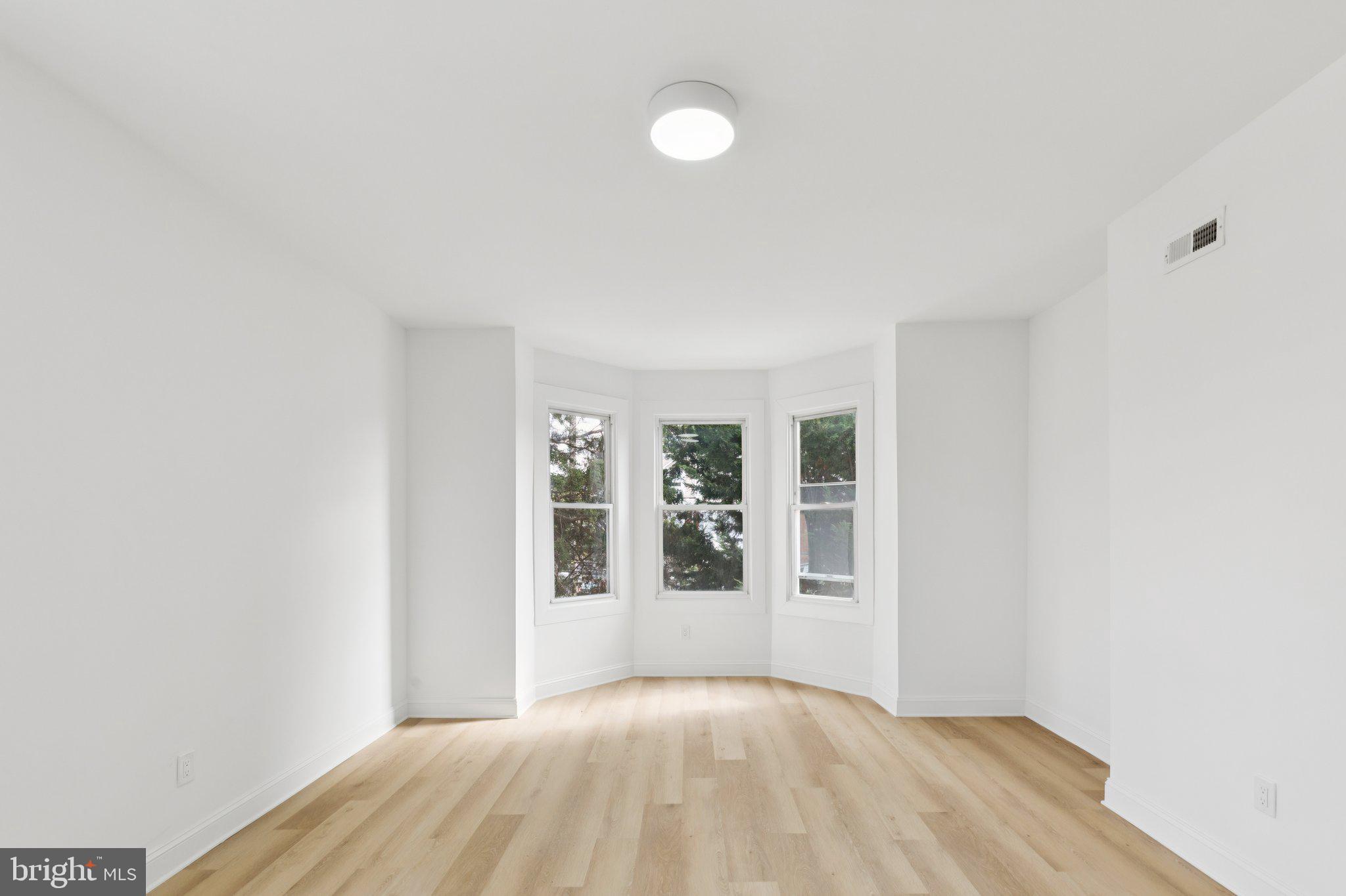 137 Manheim Street Philadelphia, PA 19144 - Photo 19 of 81 a view of an empty room with a window