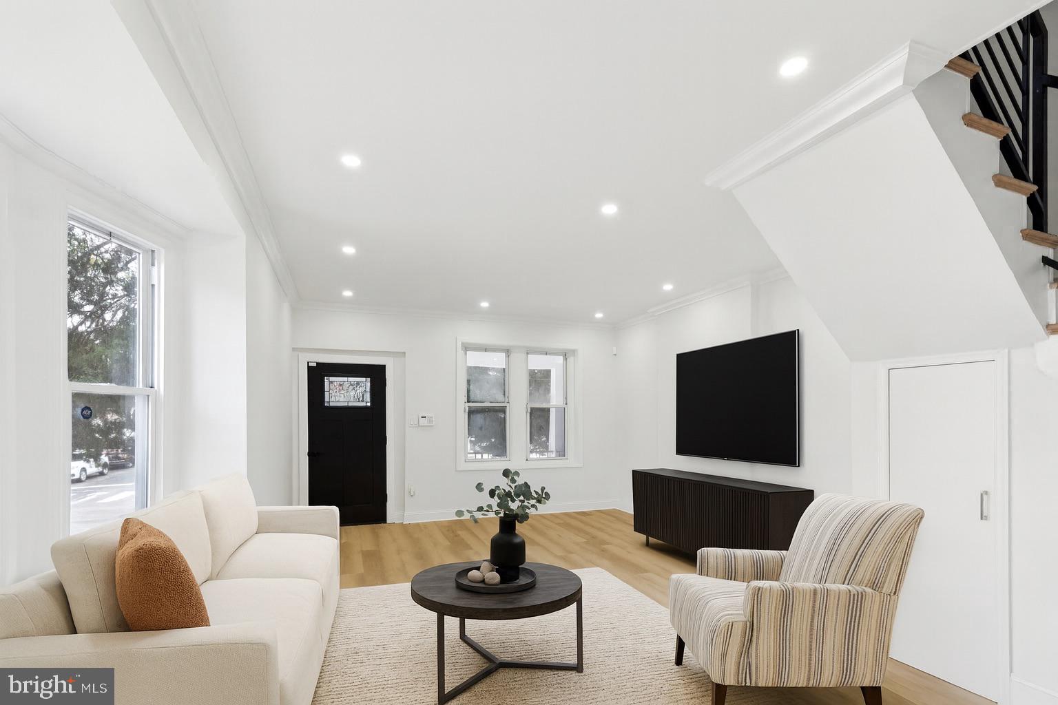 137 Manheim Street Philadelphia, PA 19144 - Photo 2 of 81 a living room with furniture and a flat screen tv