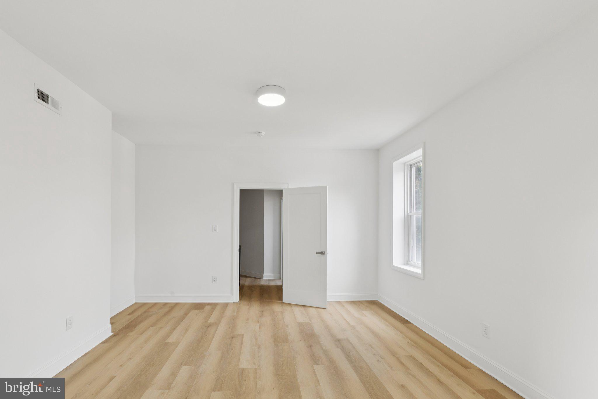137 Manheim Street Philadelphia, PA 19144 - Photo 21 of 81 a view of an empty room with window and closet area