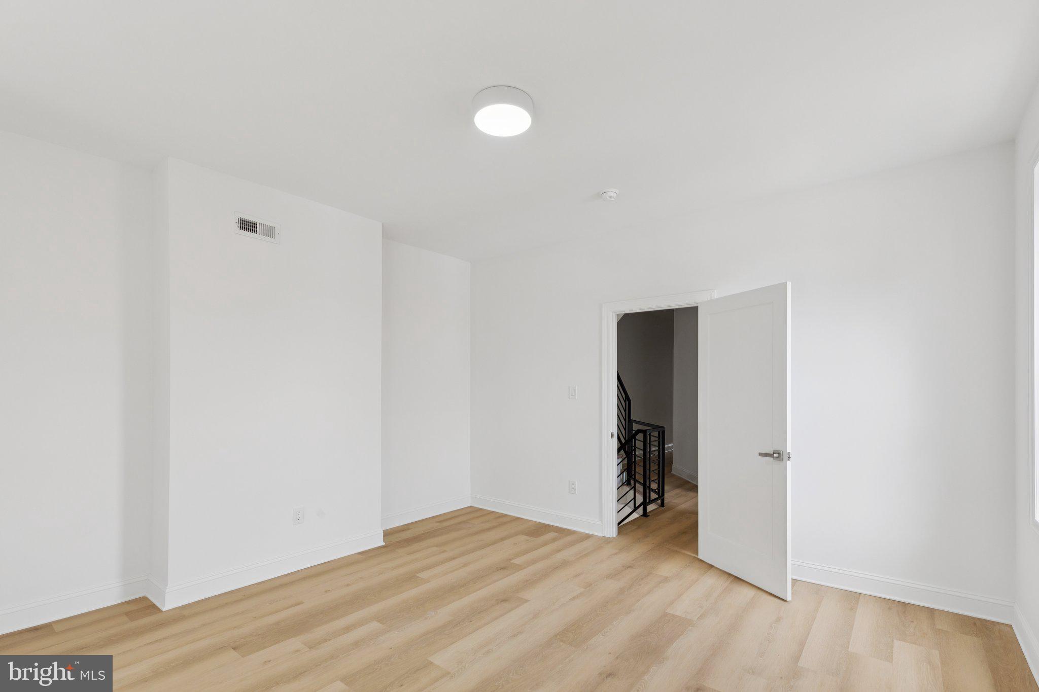137 Manheim Street Philadelphia, PA 19144 - Photo 22 of 81 a view of an empty room with wooden floor and closet