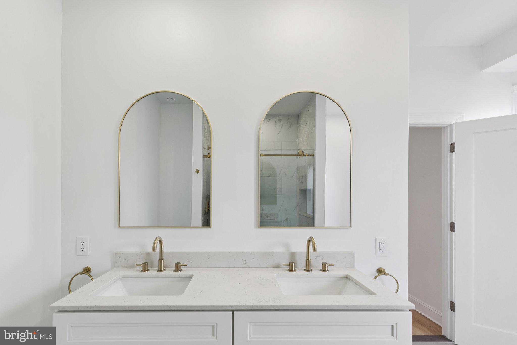 137 Manheim Street Philadelphia, PA 19144 - Photo 38 of 81 a bathroom with 2 sink and a mirror