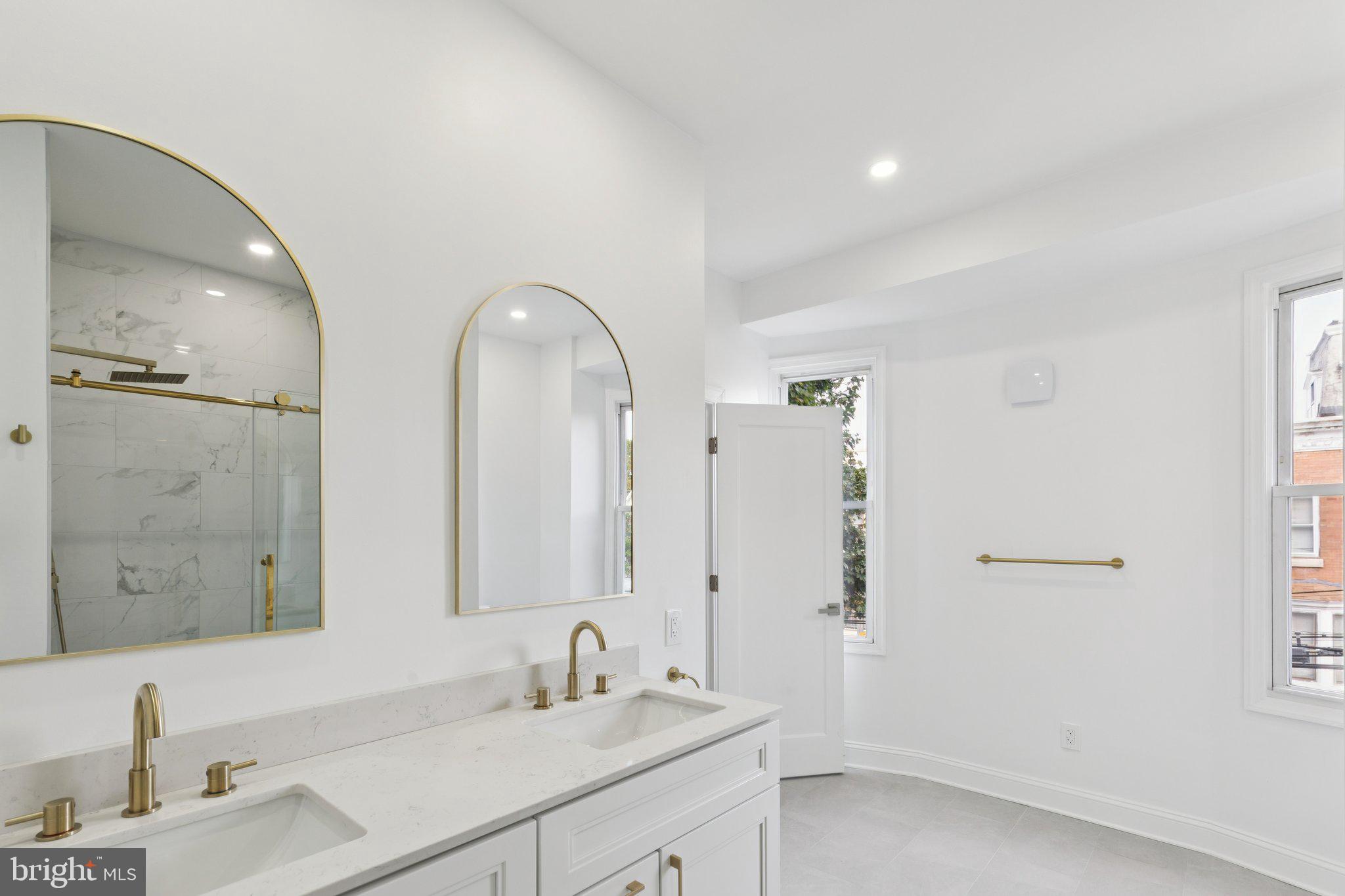 137 Manheim Street Philadelphia, PA 19144 - Photo 39 of 81 a bathroom with a double vanity sink mirror and double