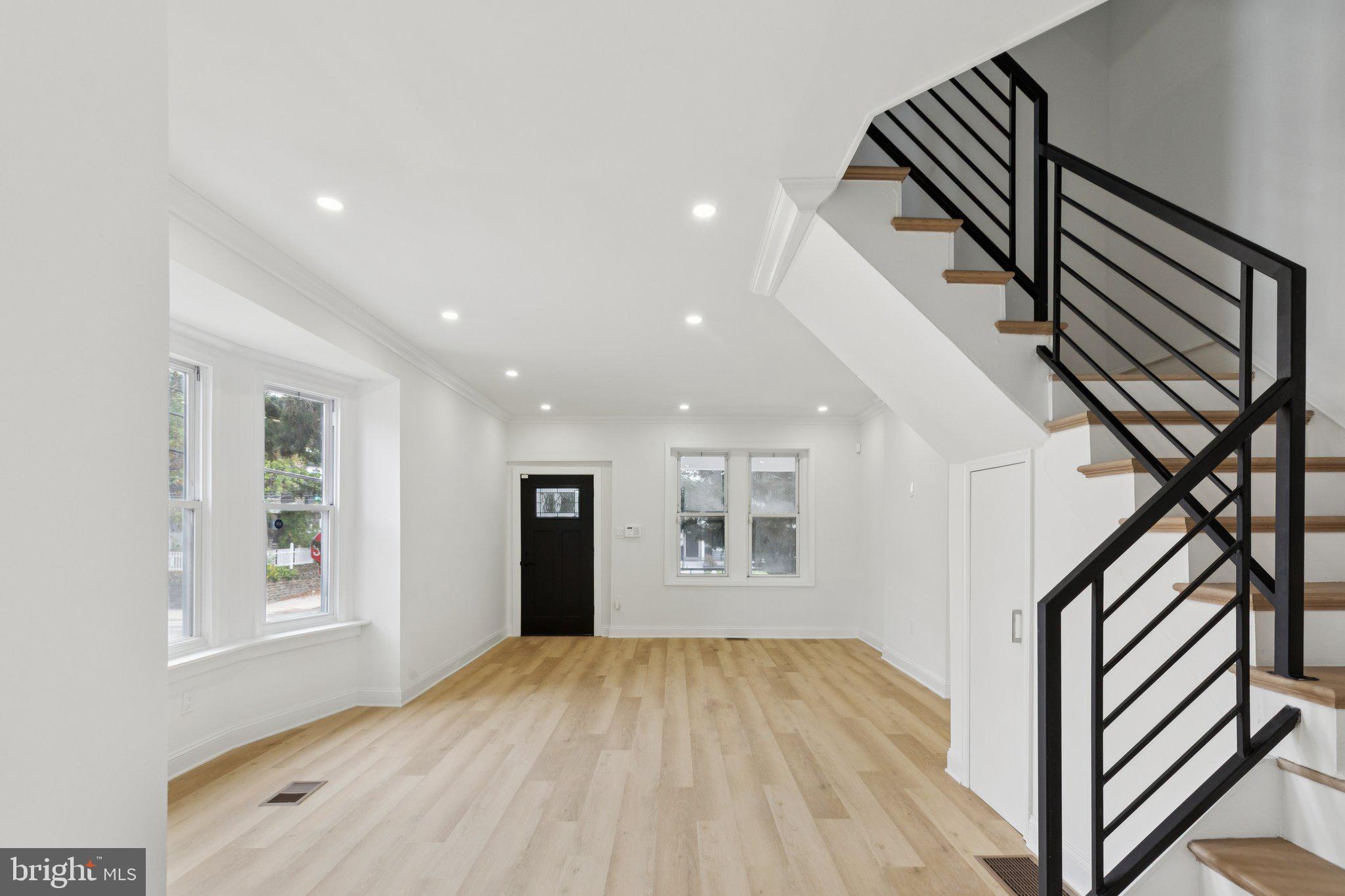 137 Manheim Street Philadelphia, PA 19144 - Photo 8 of 81 a view of an empty room with wooden floor and a window
