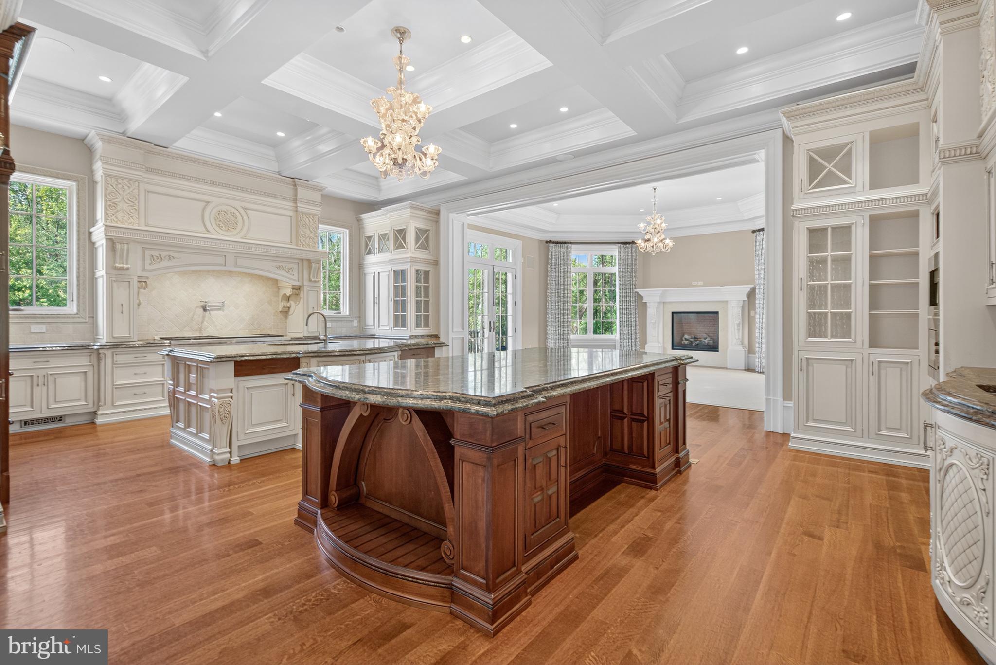 1174 Old Tolson Mill Road McLean, VA 22102 - Photo 11 of 35 a large kitchen with stainless steel appliances granite countertop a lot of cabinets and wooden floor