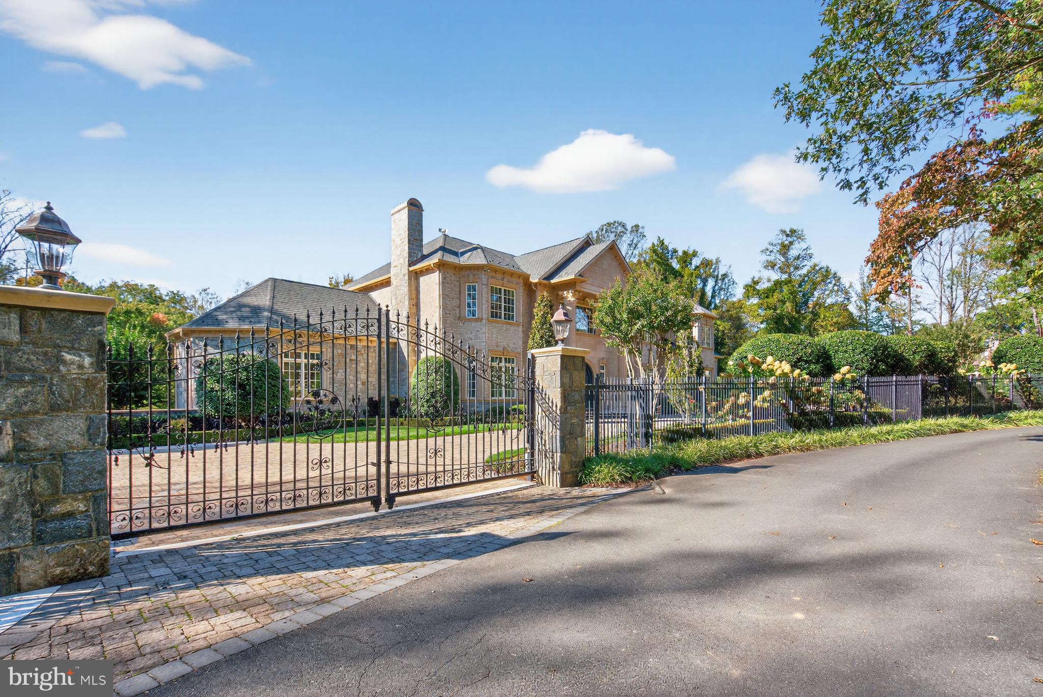 1174 Old Tolson Mill Road McLean, VA 22102 - Photo 32 of 35 a view of a house with a small yard and large trees