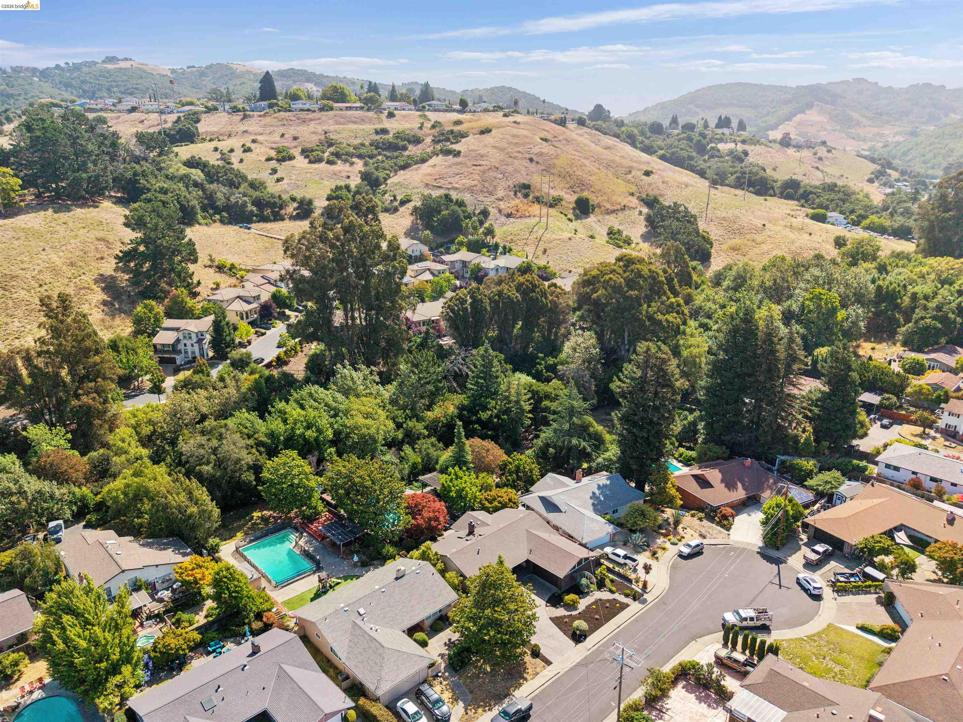 7 Jo Lin Court El Sobrante, CA 94803 - Photo 6 of 99 Aerial perspective showcasing a residential neighborhood with surrounding hills