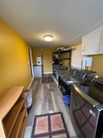 a kitchen with a stove and a refrigerator