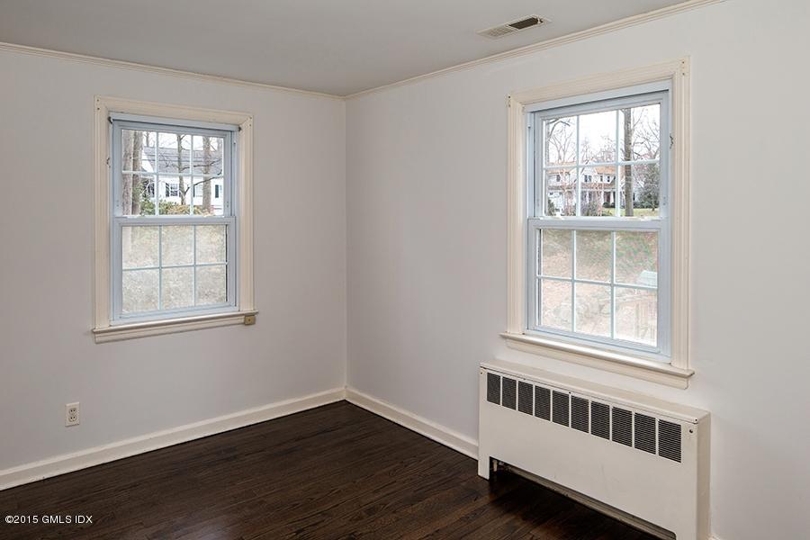 65 Winthrop Drive Riverside, CT 06878 - Photo 11 of 13 an empty room with wooden floor and windows