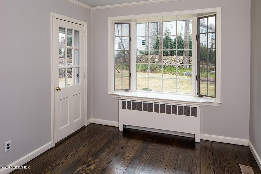 65 Winthrop Drive Riverside, CT 06878 - Photo 5 of 13 a view of a room with wooden floor and windows