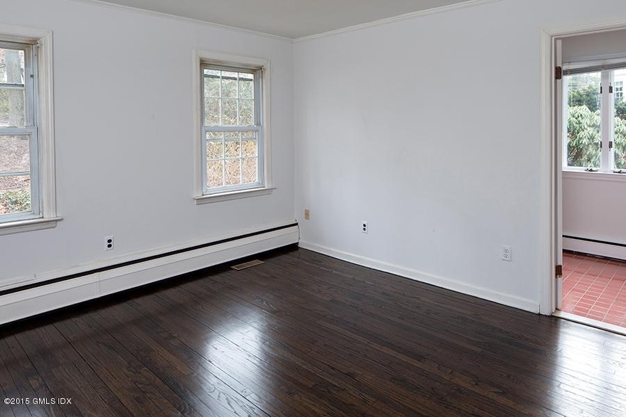 65 Winthrop Drive Riverside, CT 06878 - Photo 8 of 13 an empty room with wooden floor and windows