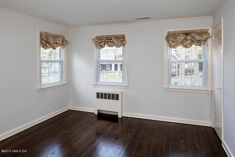 65 Winthrop Drive Riverside, CT 06878 - Photo 9 of 13 a view of a big room with wooden floor and windows
