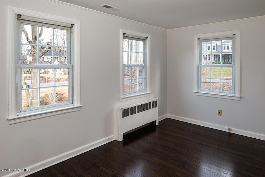 65 Winthrop Drive Riverside, CT 06878 - Photo 10 of 13 a view of an empty room with wooden floor and a window