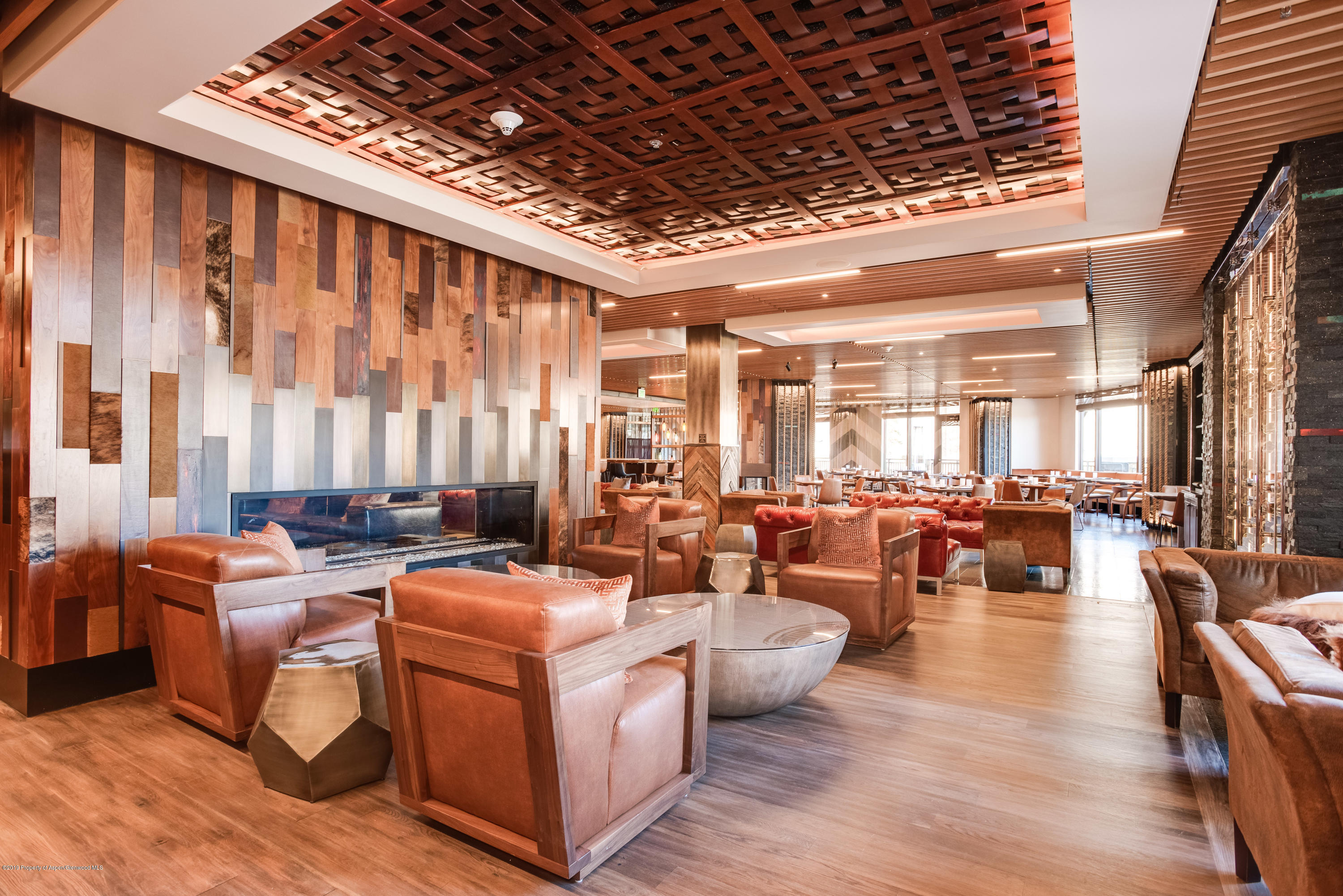 130 Wood Road, Unit 736 Snowmass Village, CO 81615 - Photo 3 of 12 a very nice looking living room with furniture and a large window