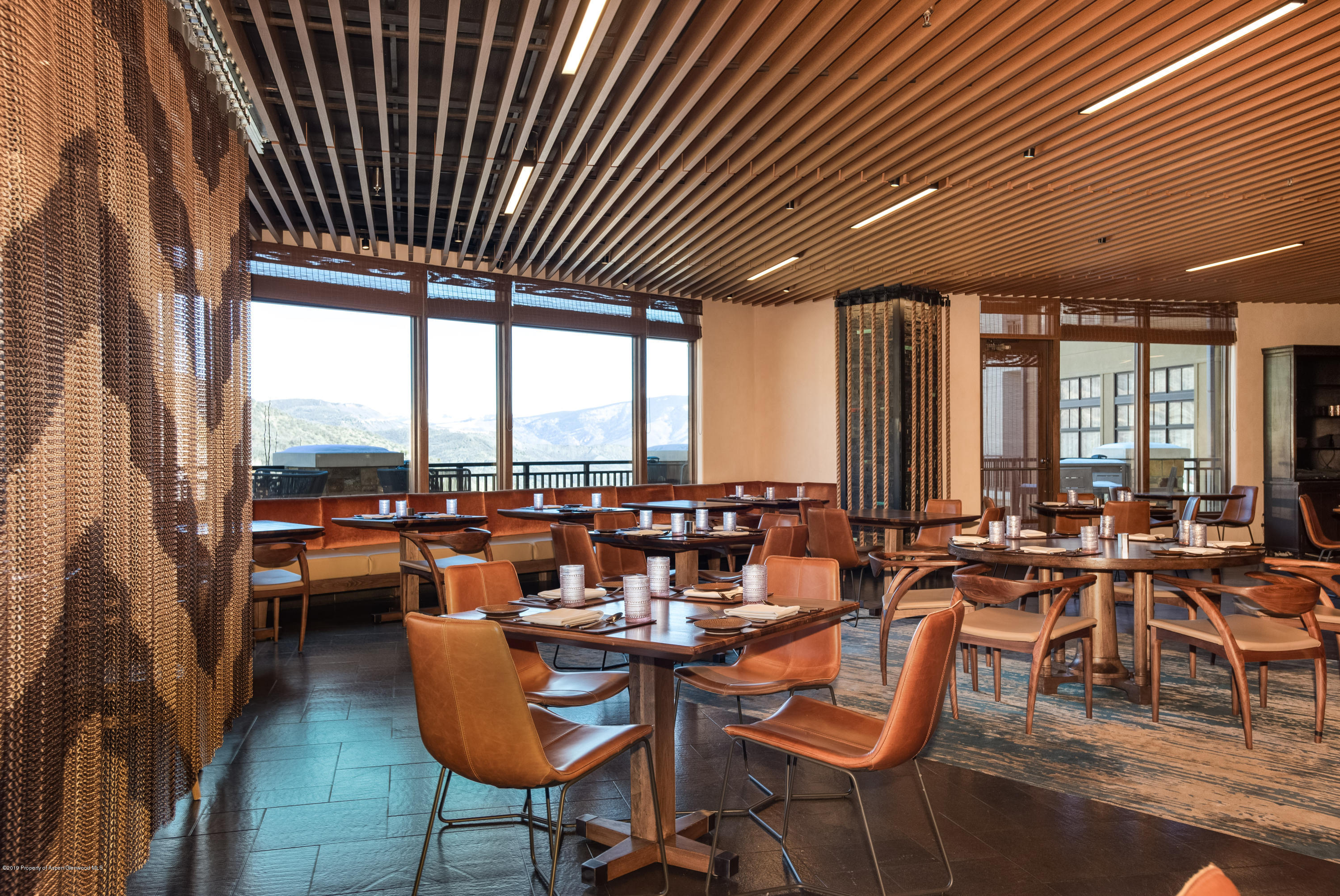 130 Wood Road, Unit 736 Snowmass Village, CO 81615 - Photo 4 of 12 a very nice looking living room with furniture and a floor to ceiling window