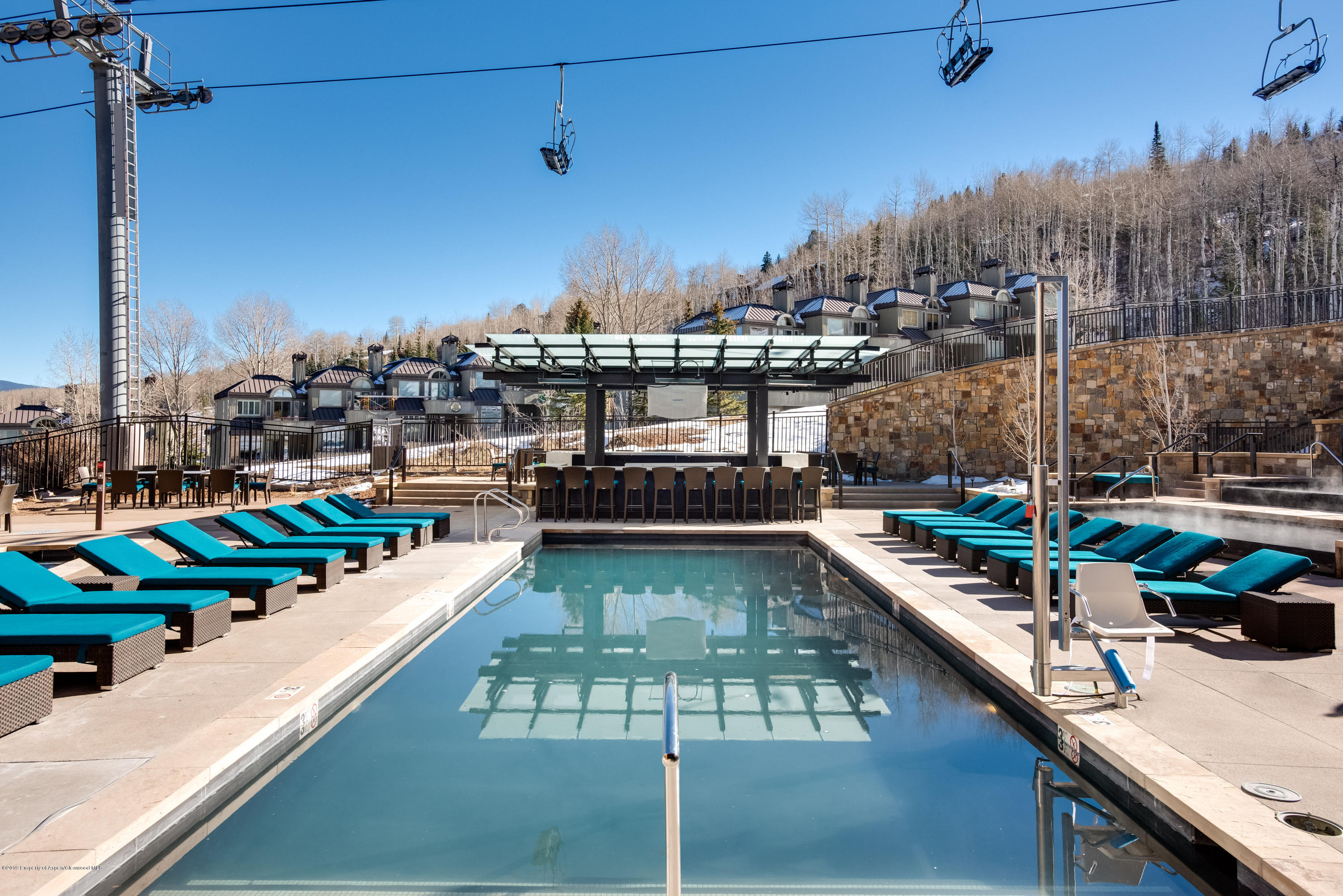 130 Wood Road, Unit 736 Snowmass Village, CO 81615 - Photo 8 of 12 a view of a swimming pool with seating area
