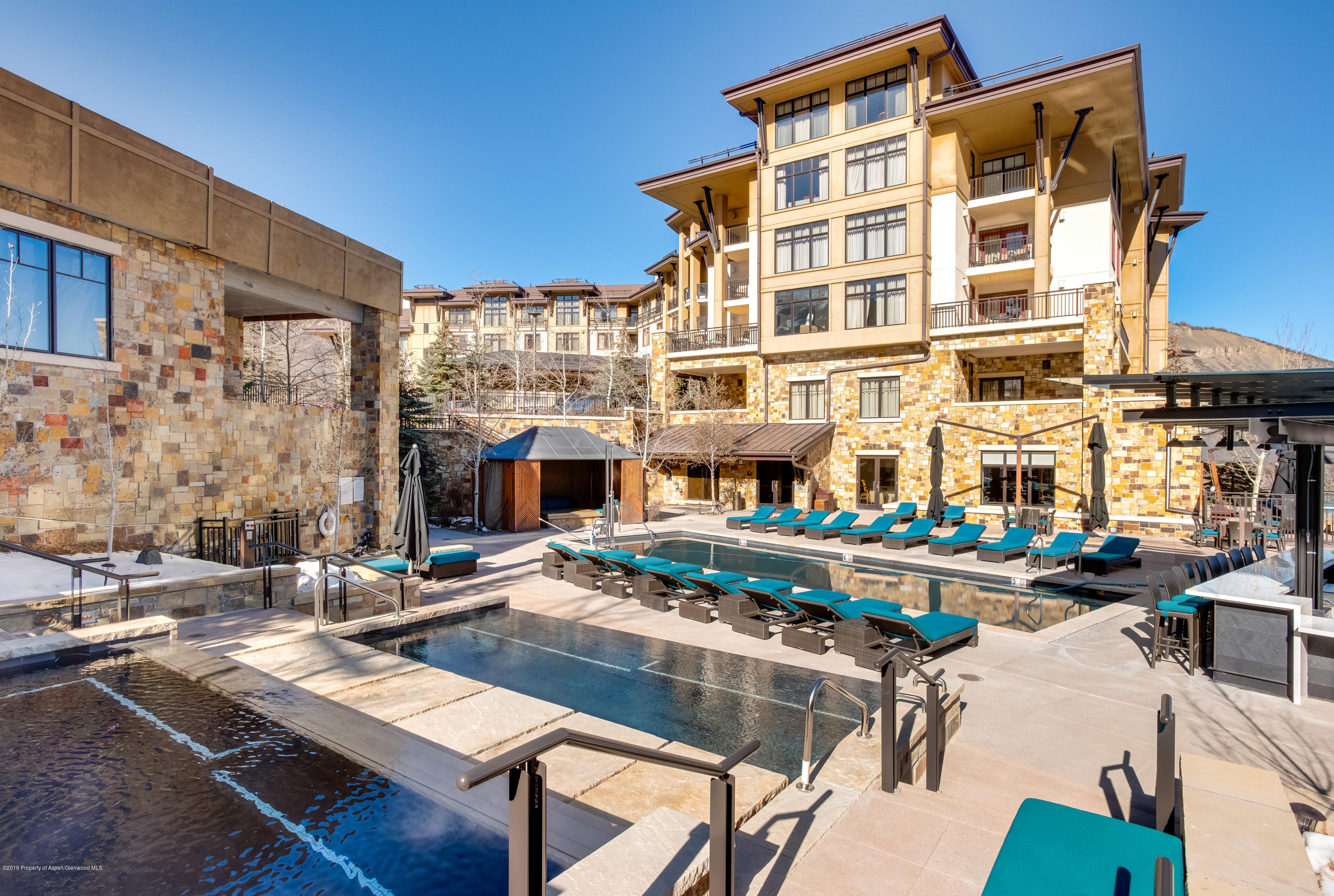 130 Wood Road, Unit 736 Snowmass Village, CO 81615 - Photo 10 of 12 a front view of a building with sitting area