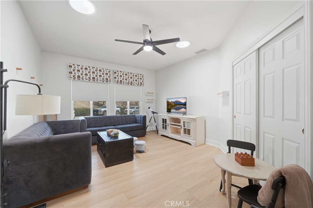 41110 Los Ranchos Circle Temecula, CA 92592 - Photo 39 of 77 a living room with furniture and a flat screen tv