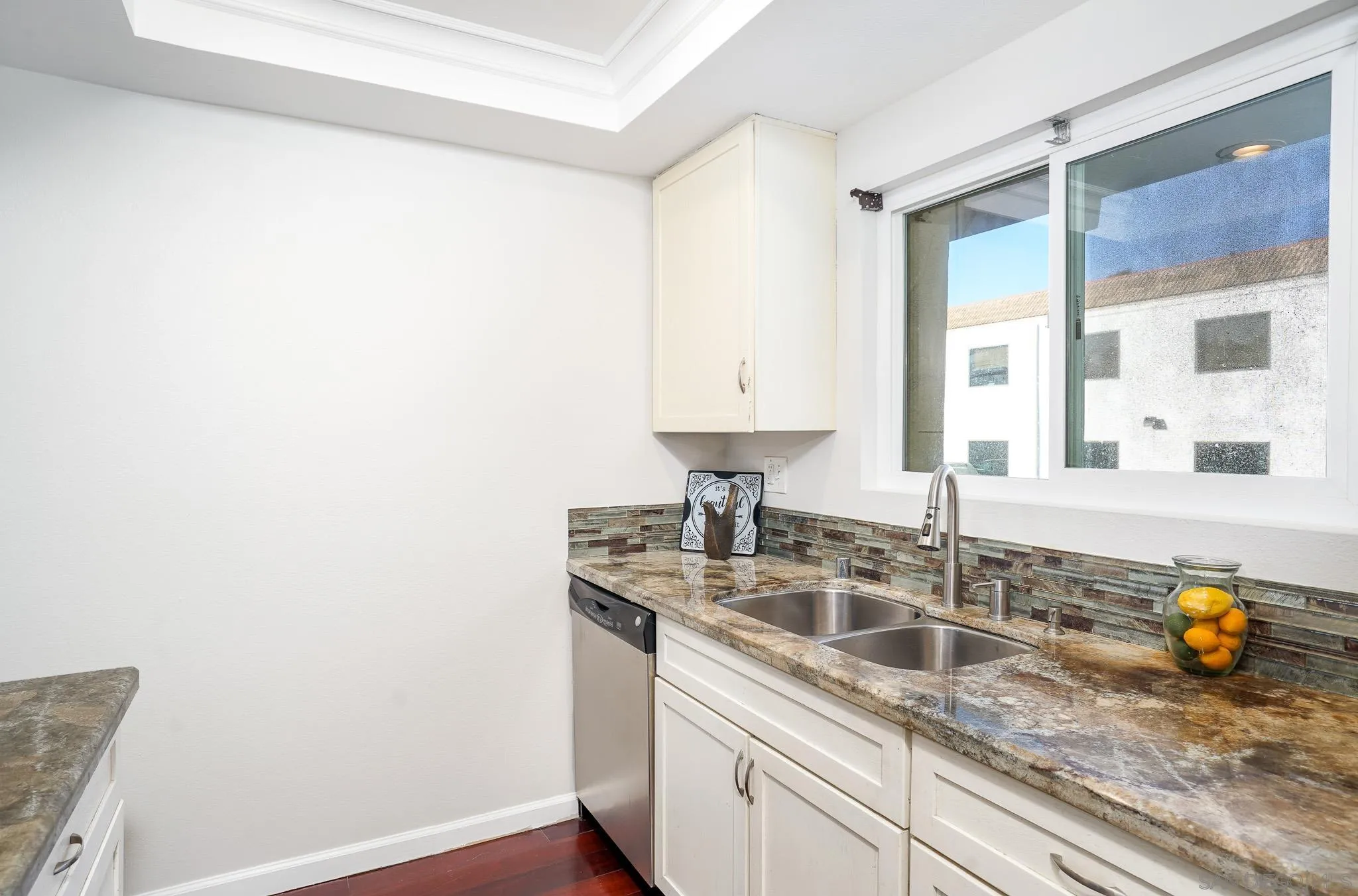 6069 Rancho Mission Road, Unit 201 San Diego, CA 92108 - Photo 15 of 43 a kitchen with a sink and a window