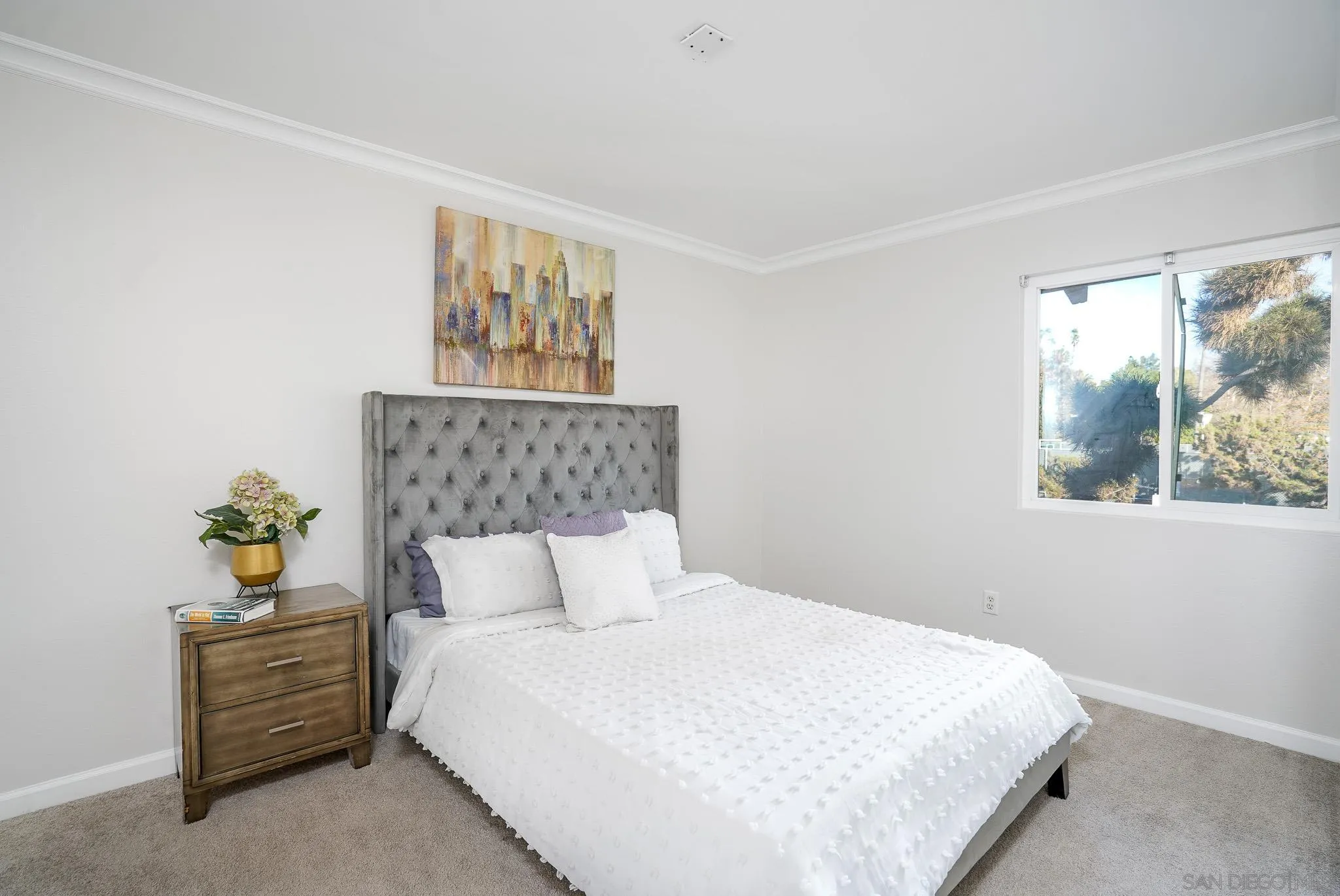 6069 Rancho Mission Road, Unit 201 San Diego, CA 92108 - Photo 18 of 43 a bedroom with bed and window