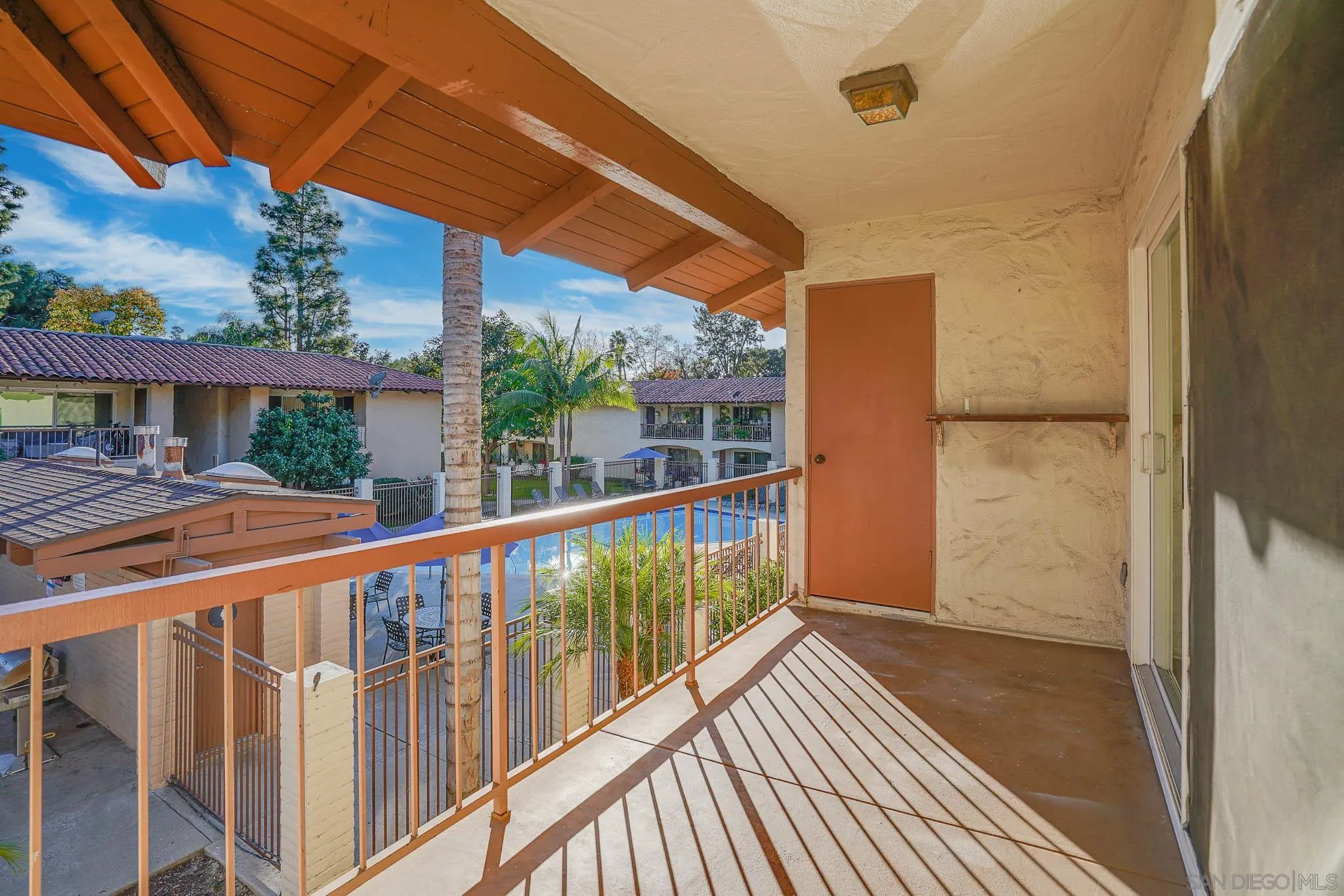 6069 Rancho Mission Road, Unit 201 San Diego, CA 92108 - Photo 27 of 43 a view of balcony with a swimming pool