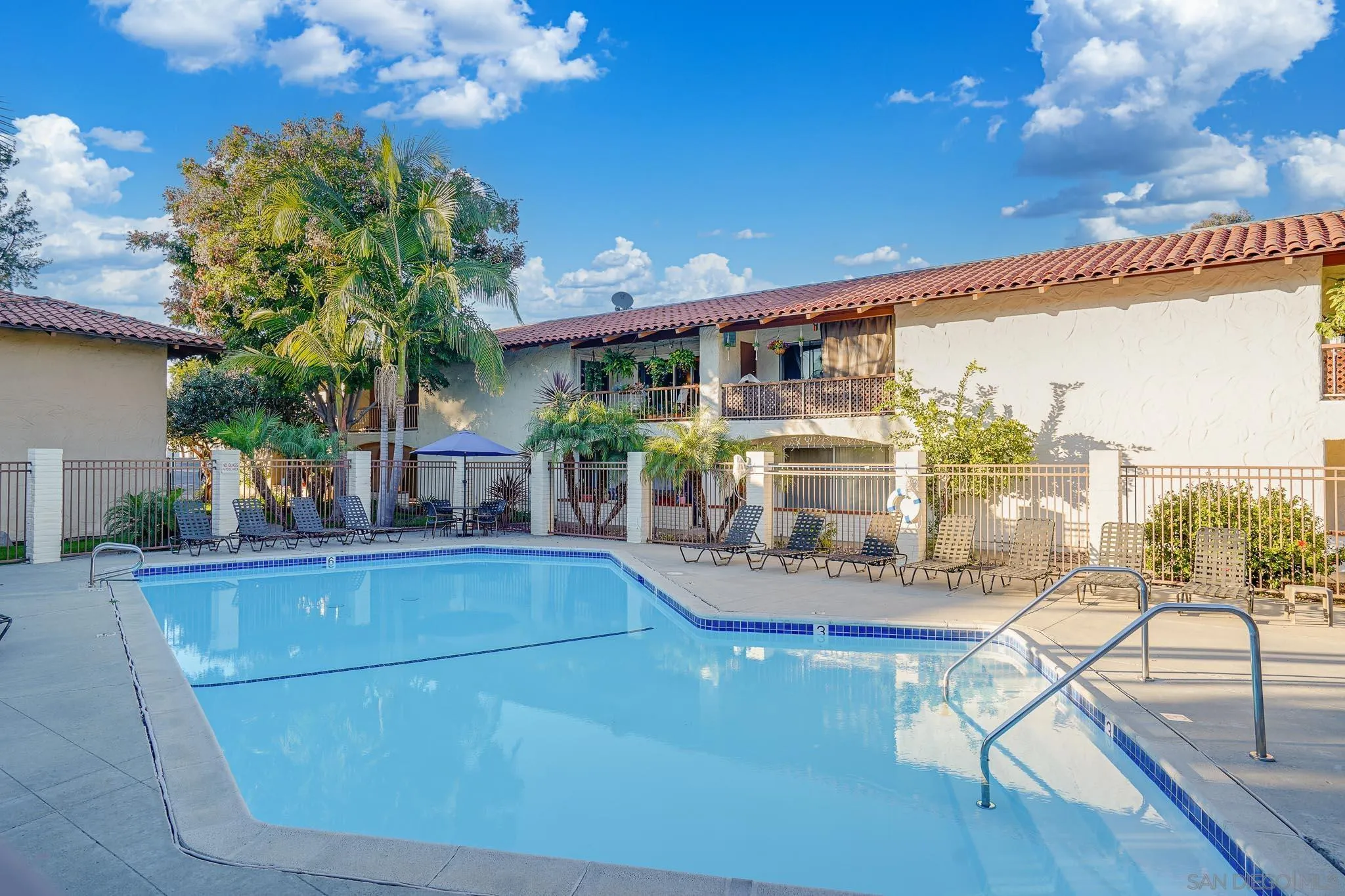 6069 Rancho Mission Road, Unit 201 San Diego, CA 92108 - Photo 33 of 43 a view of a chairs and table in a patio