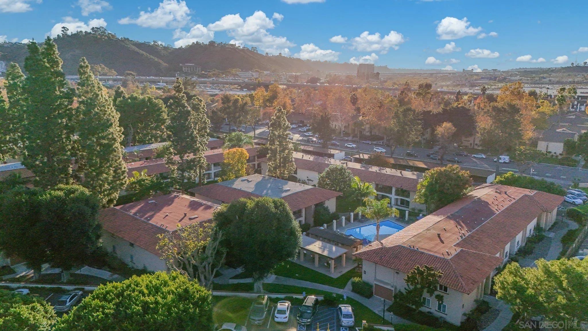 6069 Rancho Mission Road, Unit 201 San Diego, CA 92108 - Photo 41 of 43 a view of a city with lots of residential buildings ocean and mountain view in back