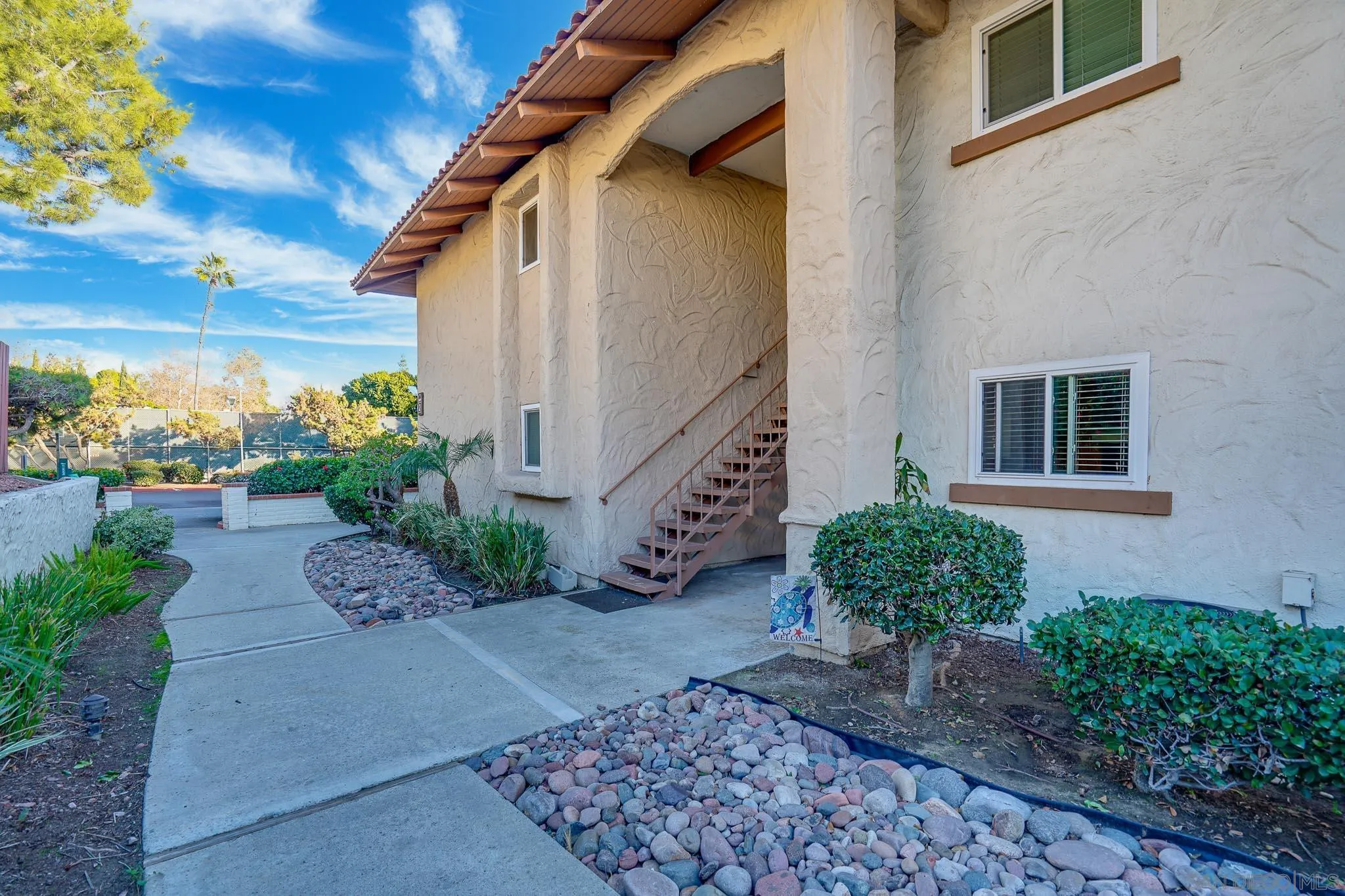 6069 Rancho Mission Road, Unit 201 San Diego, CA 92108 - Photo 5 of 43 a view of a pathway with a house
