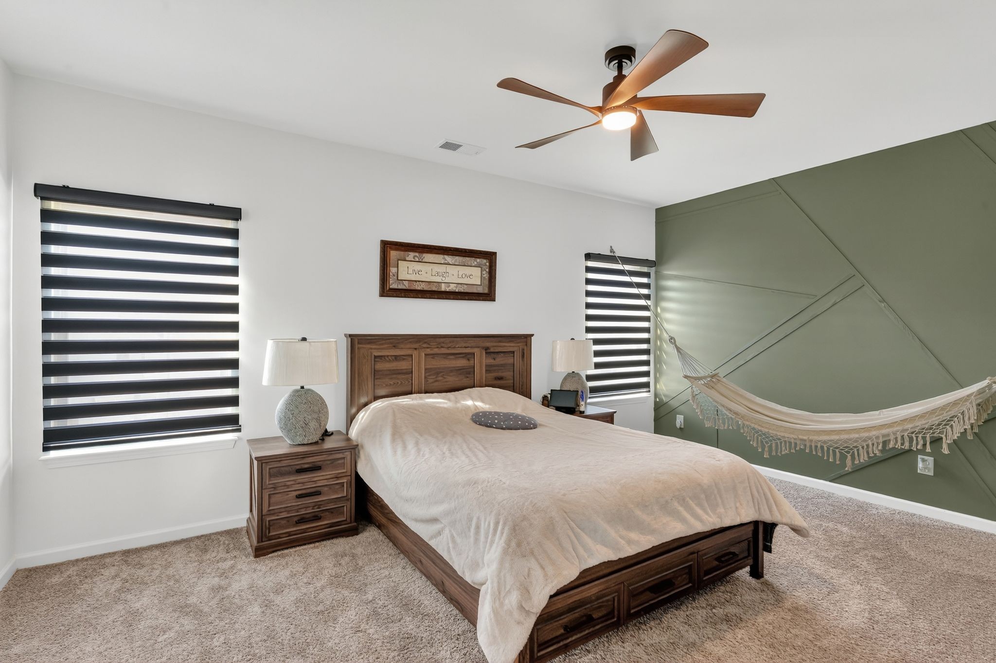 348 Winston Way Gallatin, TN 37066 - Photo 16 of 27 a bedroom with a bed and a chandelier