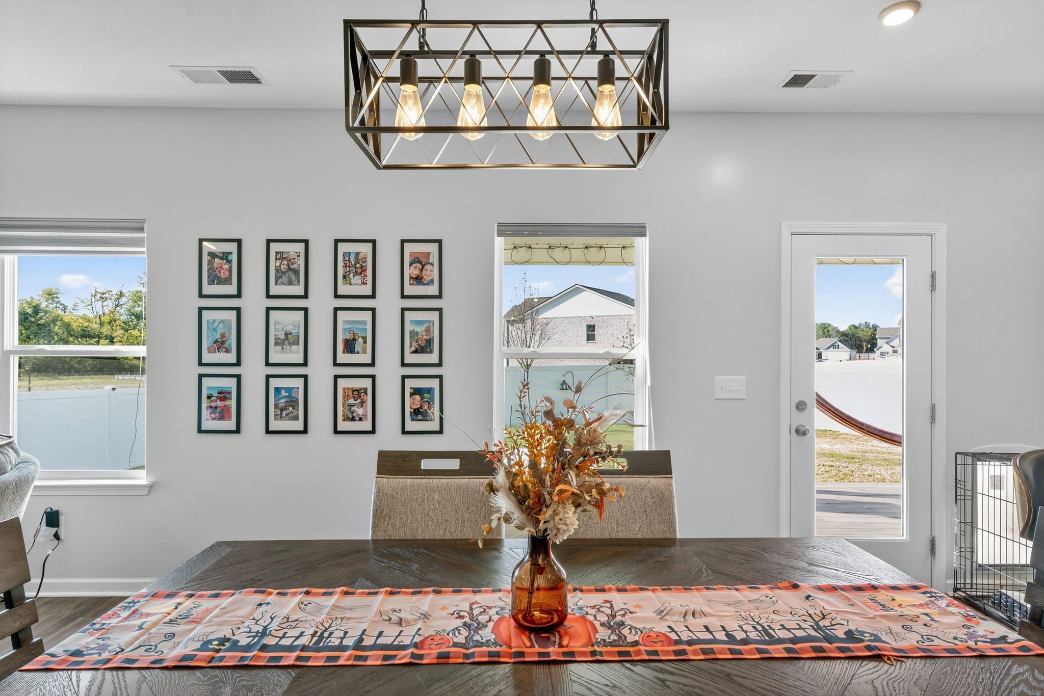 348 Winston Way Gallatin, TN 37066 - Photo 9 of 27 a front view of a house with dining space wooden floor and a chandelier
