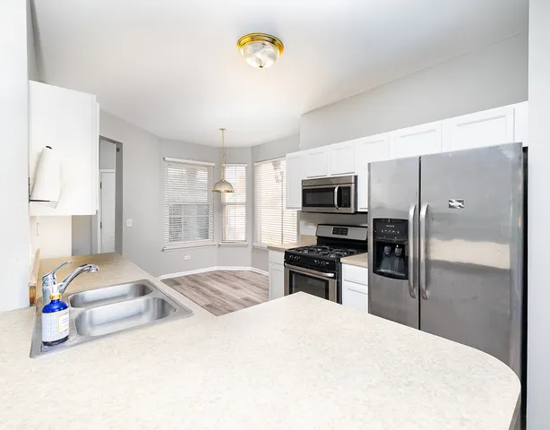 a bedroom with a bed and a television