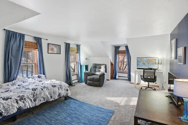 a bedroom with a bed and a couch