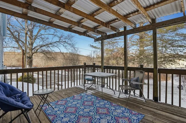 a view of a porch with furniture