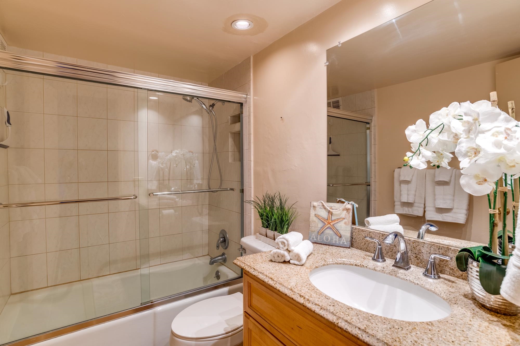 2191 South Kihei Road, Unit 2317 Kihei, HI 96753 - Photo 12 of 30 a bathroom with a granite countertop sink toilet and shower
