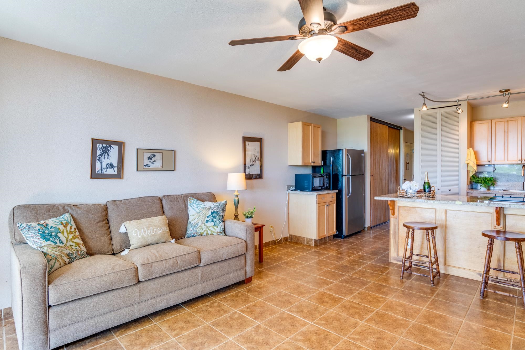 2191 South Kihei Road, Unit 2317 Kihei, HI 96753 - Photo 16 of 30 a living room with furniture and kitchen view