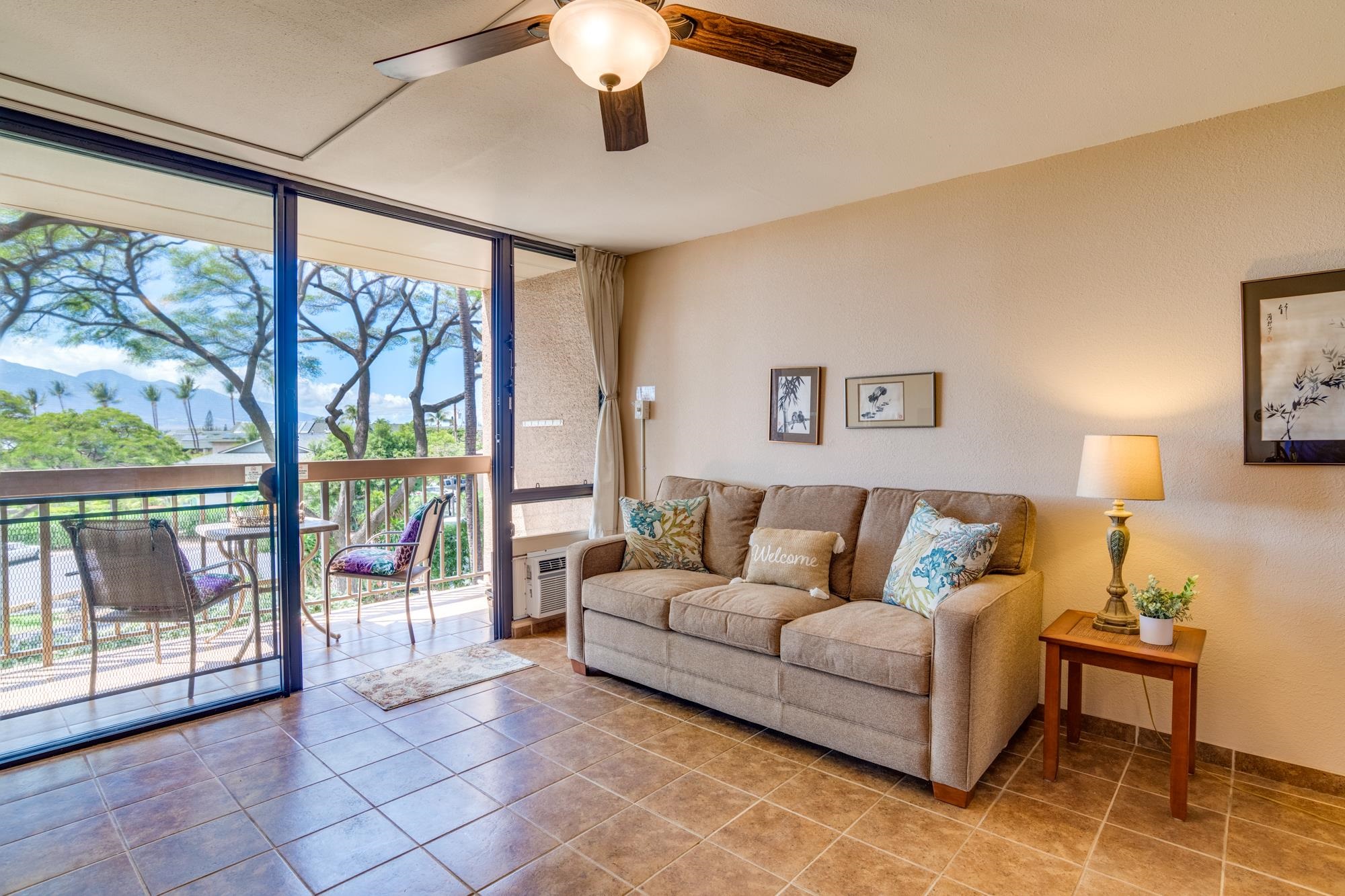 2191 South Kihei Road, Unit 2317 Kihei, HI 96753 - Photo 3 of 30 a living room with furniture and a large window