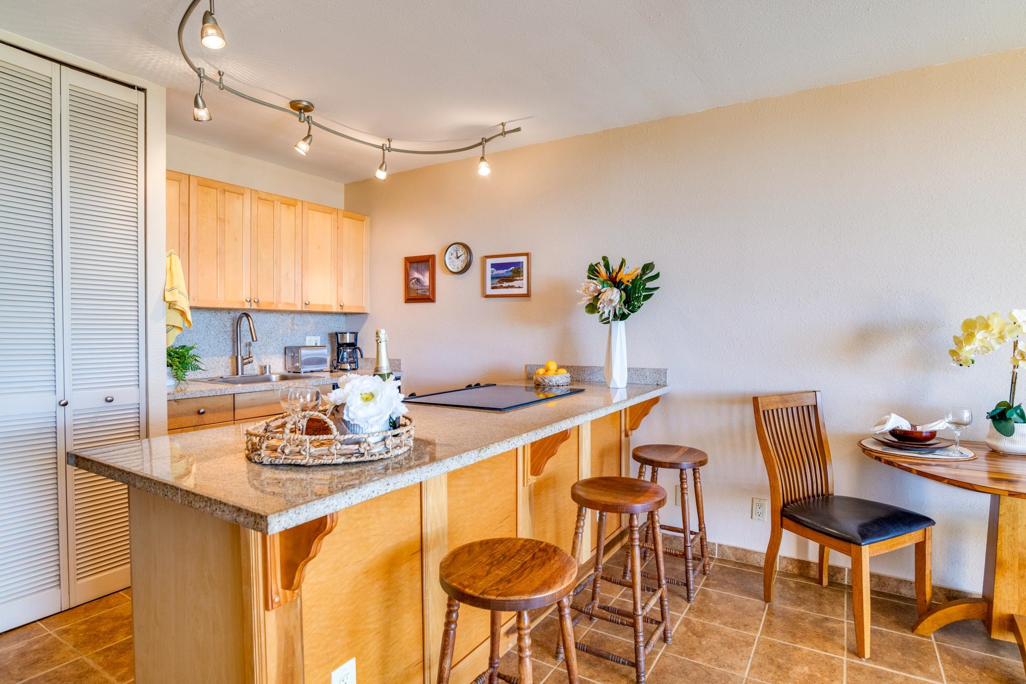 2191 South Kihei Road, Unit 2317 Kihei, HI 96753 - Photo 5 of 30 a kitchen with a dining table and chairs