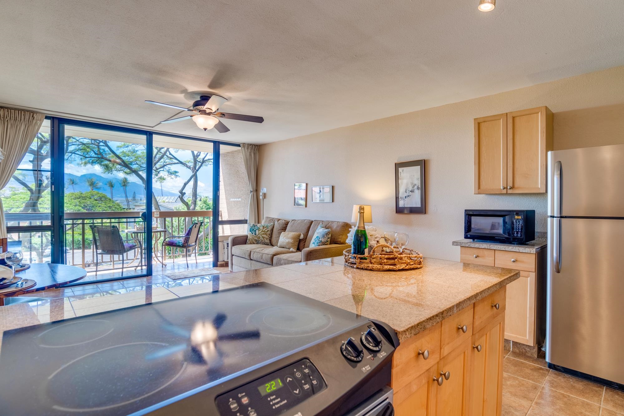 2191 South Kihei Road, Unit 2317 Kihei, HI 96753 - Photo 8 of 30 a living room with stainless steel appliances furniture and a table