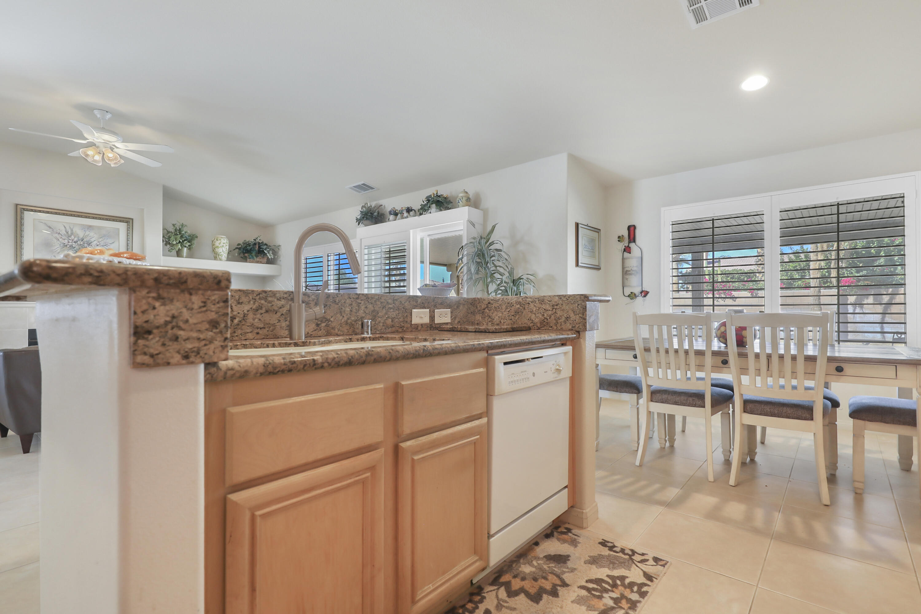 80628 Virginia Avenue Indio, CA 92201 - Photo 14 of 34 a kitchen with granite countertop cabinets and chair