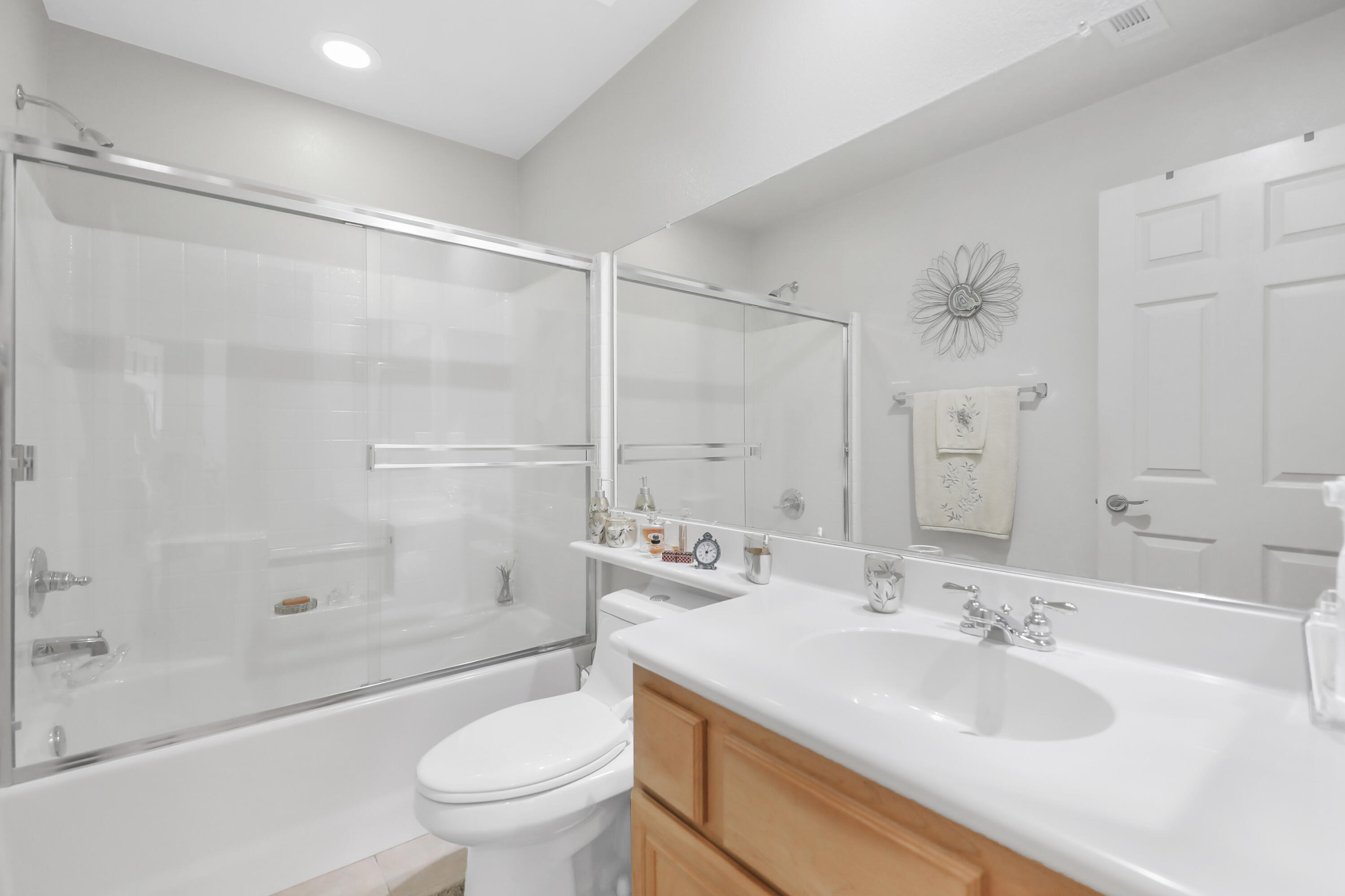 80628 Virginia Avenue Indio, CA 92201 - Photo 16 of 34 a bathroom with a sink a toilet and a large mirror