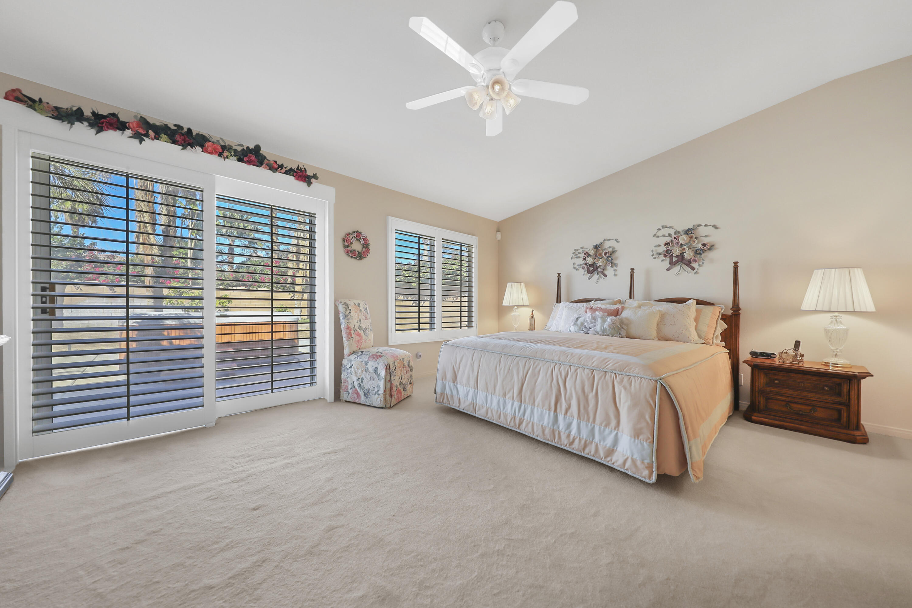 80628 Virginia Avenue Indio, CA 92201 - Photo 17 of 34 a spacious bedroom with a bed and a large window