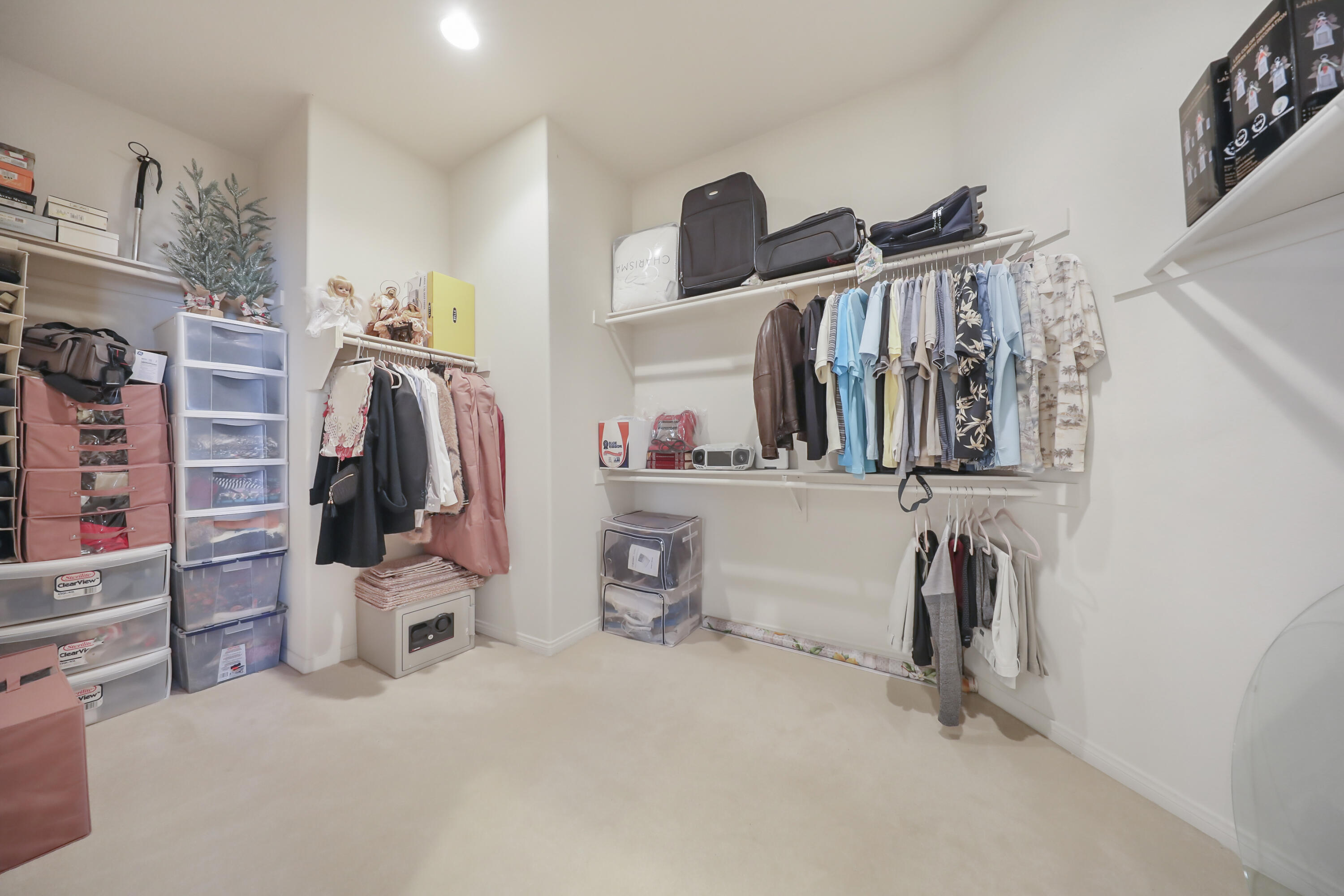80628 Virginia Avenue Indio, CA 92201 - Photo 20 of 34 a view of walk in closet with clothes and shoes