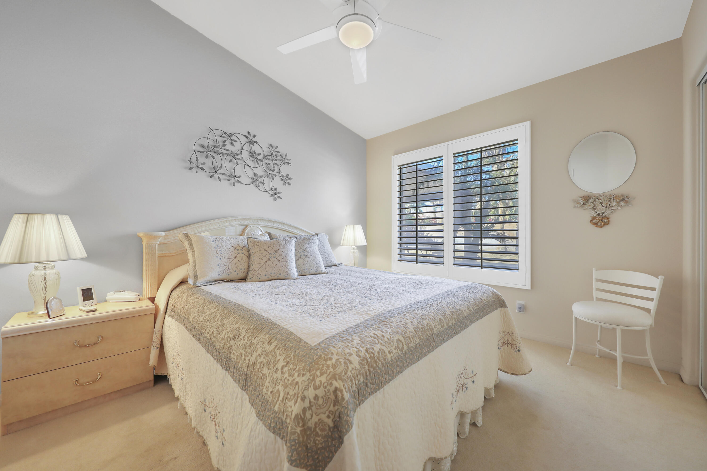 80628 Virginia Avenue Indio, CA 92201 - Photo 21 of 34 a spacious bedroom with a bed and a cabinets