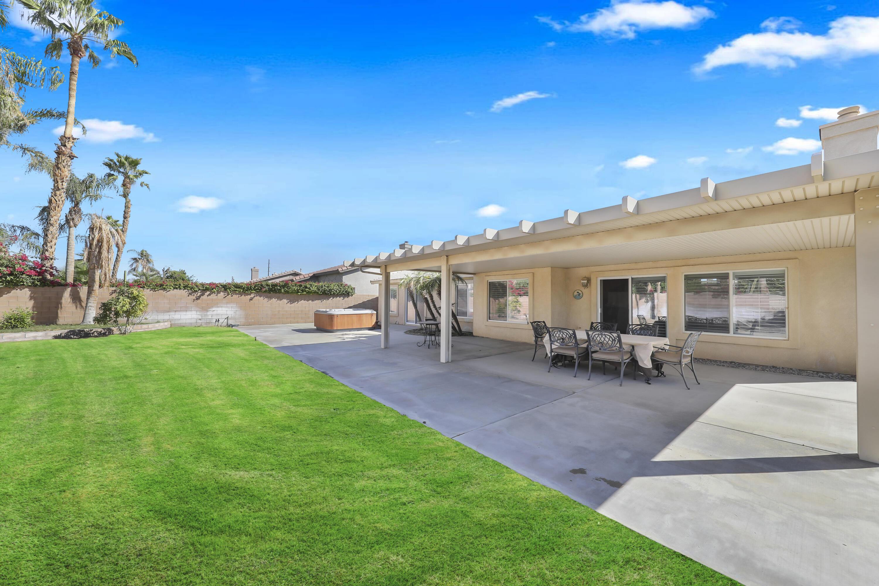 80628 Virginia Avenue Indio, CA 92201 - Photo 26 of 34 a view of a house with patio and garden