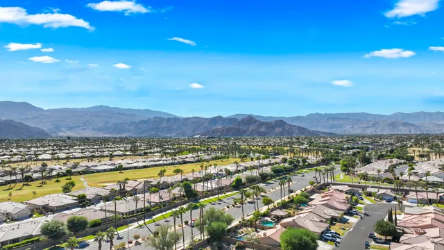 a view of a city with mountains in the background