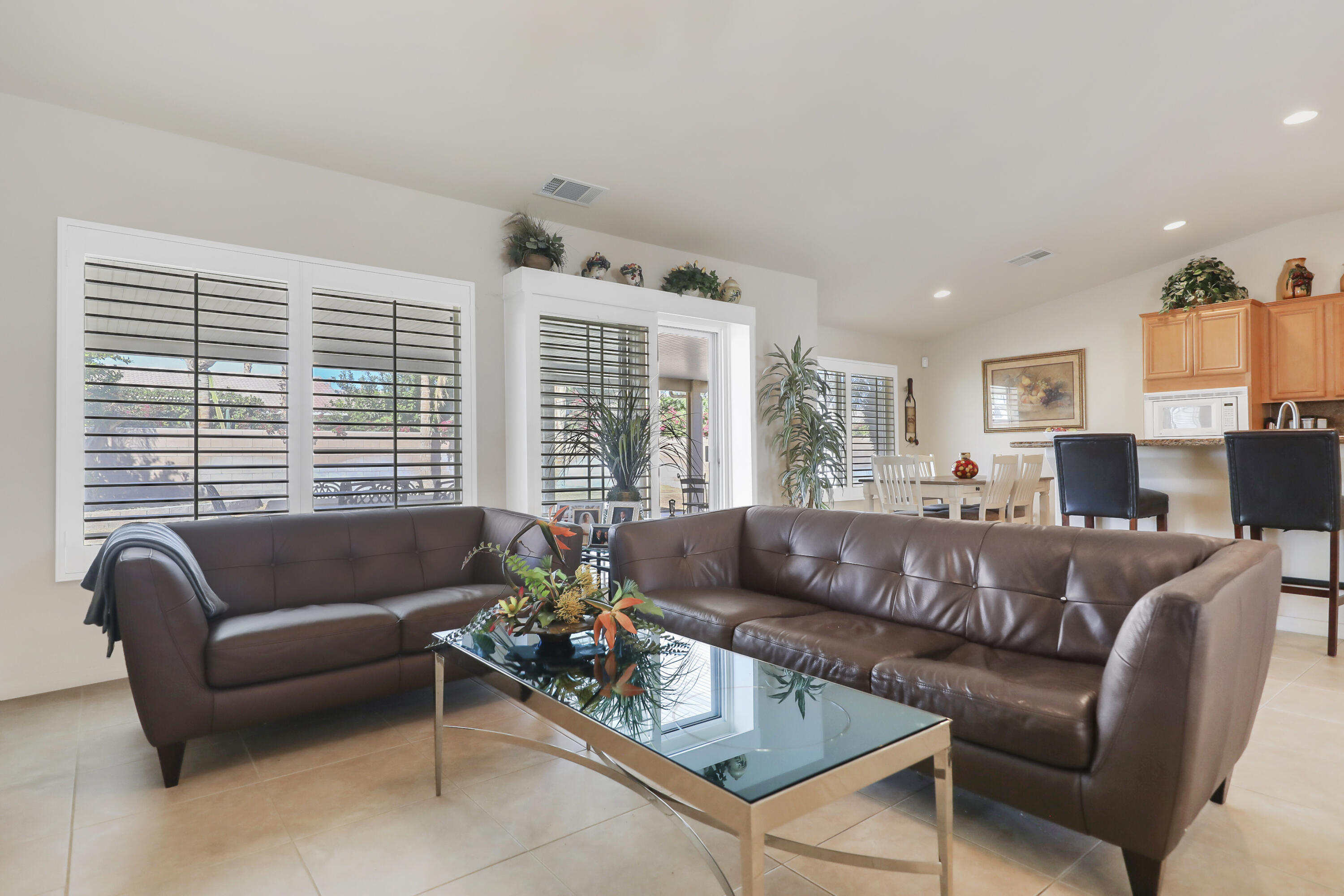 80628 Virginia Avenue Indio, CA 92201 - Photo 8 of 34 a living room with furniture and a large window