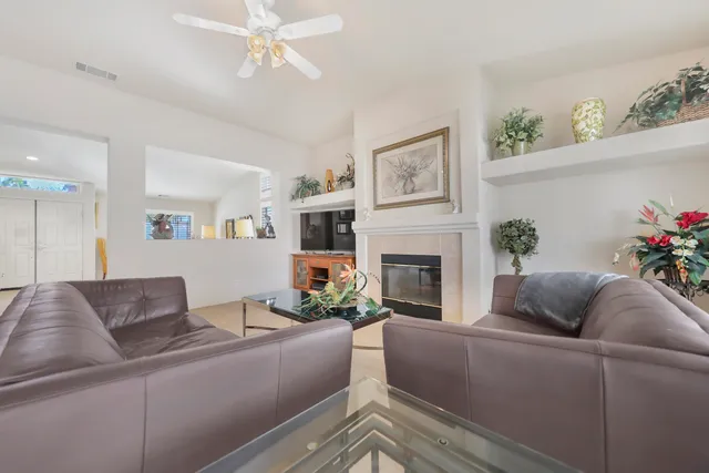 a living room with furniture and a fireplace