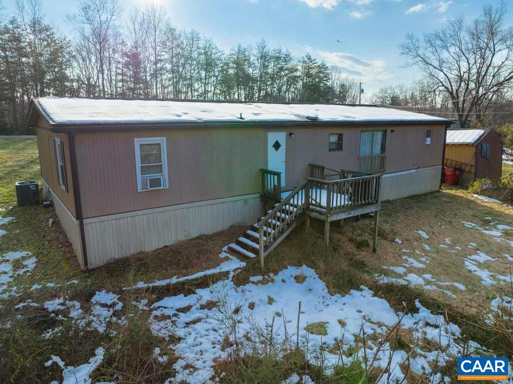 1363 Dunnes Shop Road Ruckersville, VA 22968 - Photo 15 of 29 a view of a house with a yard