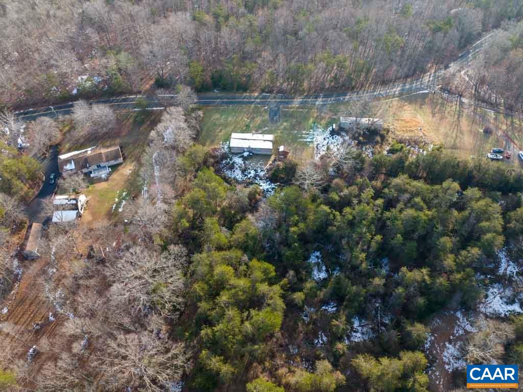 1363 Dunnes Shop Road Ruckersville, VA 22968 - Photo 4 of 29 a backyard of a house with a yard and outdoor seating