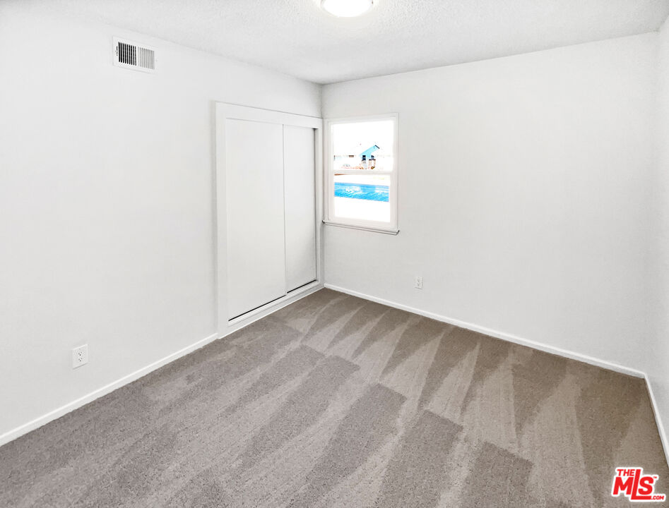 1616 West Piru Street Compton, CA 90222 - Photo 5 of 19 a view of a closet in a room